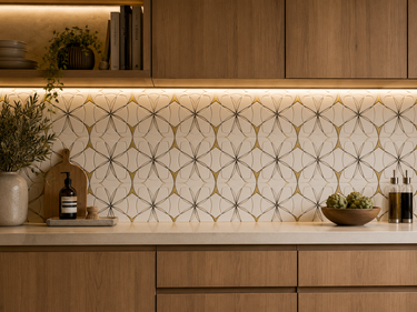 Waterjet Monaco Thassos brass and stainless steel mosaic tile by Mythology Tile, showing intricate mosaic pattern with shiny brass and steel accents.