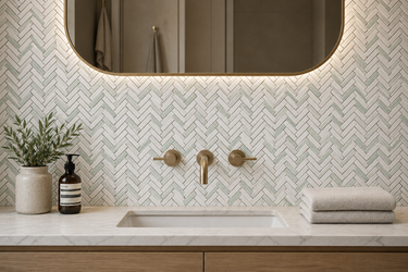 Verde white herringbone marble mosaic tile by Mythology Tile, showcasing intricate pattern and polished surface for elegant wall or floor design.