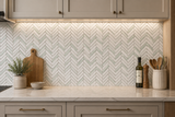 Verde white herringbone marble mosaic tile from Mythology Tile, showing intricate pattern and smooth polished surface.