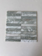White Mix 11x11 Roca natural stone pebble mosaic tile for wall installation, showing textured white pebble pattern.
