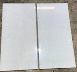 Polar White 12x24 polished natural stone tile by RN, showcasing smooth, glossy surface and modern rectangular design.