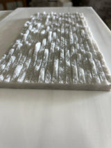 Ice White 6x12 3D split face marble tile from RN, natural stone tile with textured, split face surface in white tones.