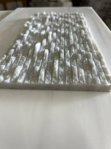Ice White 6x12 3D split face marble tile from RN, natural stone tile with textured, split face surface in white tones.