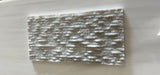 Ice White 6x12 3D split face marble tile by RN, showcasing natural stone with textured, geometric 3D surface in white tones.