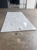 Lailak Marble 12x24 polished natural stone tile from RN, showcasing smooth, glossy marble surface with gray and white veining.