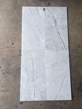 RN Lailak Marble 12x24 polished natural stone tile with gray and white veining, showcasing a sleek, glossy surface.