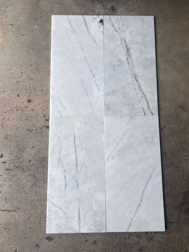 RN Lailak Marble 12x24 polished natural stone tile with gray and white veining, showcasing a sleek, glossy surface.