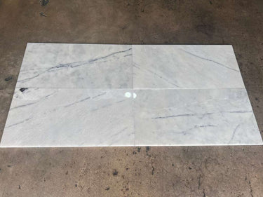 Natural stone Lailak Marble 12x24 polished tile from RN featuring a smooth, glossy surface with elegant veining and marble pattern.