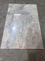 Beige Onyx 12x24 polished natural stone tile from RN, showcasing smooth, shiny surface and subtle beige veining.