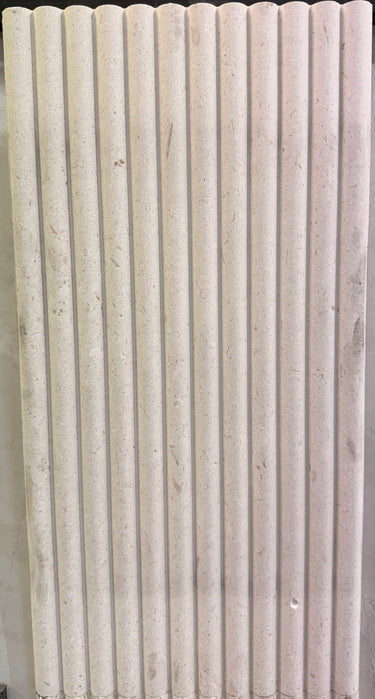 Honed Shellstone Myra fluted 12x24 limestone mosaic tile from SA, showcasing textured, natural stone surface with fluted design.