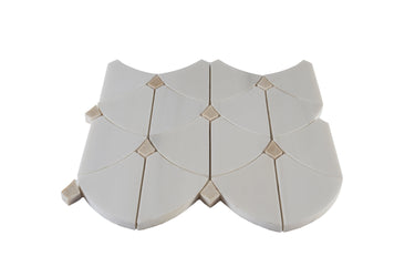 Close-up of Archie Dolomite Beige Dot marble mosaic tile from Mythology Tile, showcasing polished marble with beige and dot pattern.