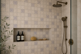 Tumbled travertine mosaic tiles in a 2x2 inch sheet by Mythology Tile, showcasing natural beige and cream tones for interior design.