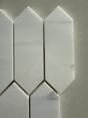 Dolomite picket honed marble mosaic installed as an elegant kitchen backsplash with soft matte finish