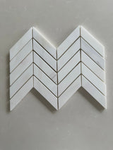 Dolomite polished 1x4 chevron marble mosaic tile featuring white marble and subtle gray veining
