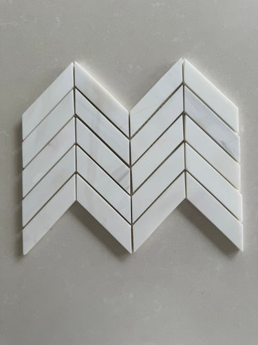Dolomite polished 1x4 chevron marble mosaic tile featuring white marble and subtle gray veining