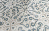 Dune Atlantique Josselin 8x8 decorative porcelain tile featuring an artisan-inspired pattern in a decorative floor installation