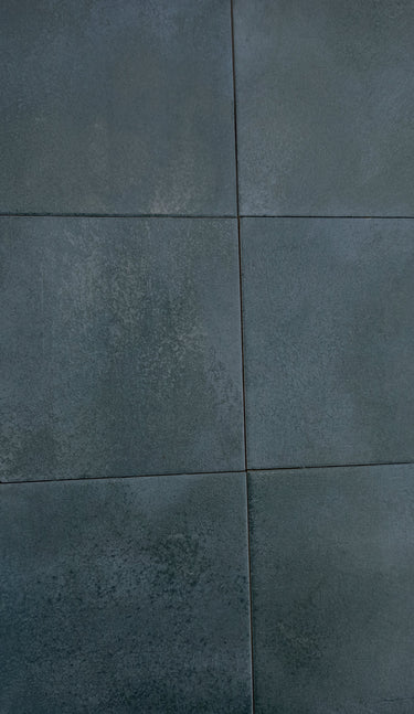 Deep blue anti-slip porcelain tile installed around a luxury swimming pool