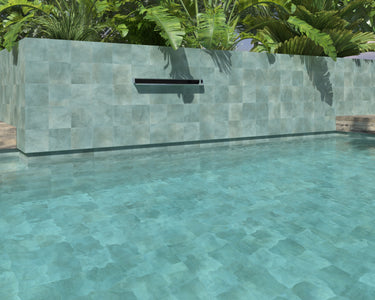 Teal anti-slip porcelain tile installed around a luxury swimming pool