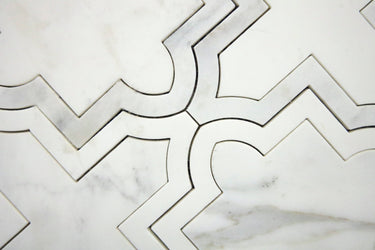 Geometric white marble mosaic tile with curved waterjet-cut pattern detail