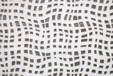 Close-up of textured white marble tile showing layered surface detail