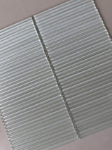 Lux Opal 12x12 fluted glass mosaic wall tile by Roca, showcasing a shimmering, textured opal finish for stylish backsplash designs.