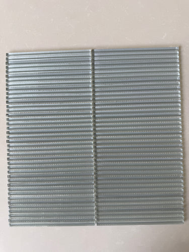 Lux Smoke 12x12 flutted glass mosaic wall tile by Roca showing textured, smoky gray glass tiles for modern interior decor.
