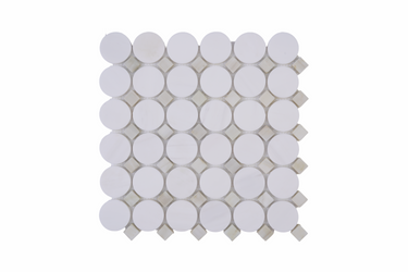 Close-up of Mythology Tile Nestor White with Green Dot and Dolomite Honed Marble Mosaic Tile showing detailed pattern and texture.