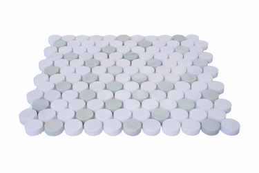 Close-up of Penny Round Green and Dolomite Honed Marble Mosaic Tile by Mythology Tile, showing glossy green and beige marble circles.