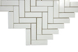 Close-up of polished Thassos marble herringbone mosaic tile