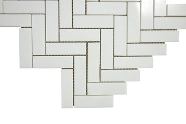 Close-up of polished Thassos marble herringbone mosaic tile