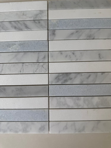 Argentina Celest Carrara and Thassos stacked mosaic used as an elegant backsplash