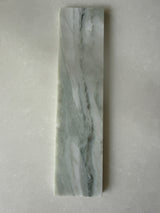 Green marble brick tile by Roca, natural stone 2x10 backsplash tile with elegant veining and smooth surface.