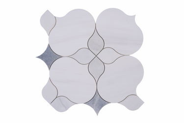 White flower waterjet honed marble mosaic tile by Mythology Tile with intricate floral pattern and smooth, polished surface.