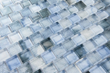 Sky blue glass mosaic tile used as a kitchen backsplash featuring luminous blue tones and contemporary design.