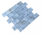 Pool-rated Crystal Aqua Sofia 2x3 glass mosaic tile installed on a luxury swimming pool waterline with reflective glass surfaces.