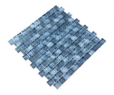 Pool-rated Stromboli Garden Blue glass mosaic tile installed on a luxury swimming pool waterline with refreshing blue color variation.