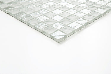 Crystal Aqua Soho White 1x1 glass mosaic tile installed as a bathroom backsplash featuring bright white tones, classic mosaic styling, and a clean contemporary appearance.
