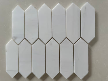 Elegant Dolomite marble picket mosaic accent wall with soft honed finish and natural stone variation
