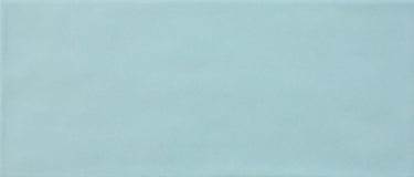 Roca Maiolica Matte Aqua 4x10 wall tiles showing a close-up of blue matte ceramic surface with subtle texture.