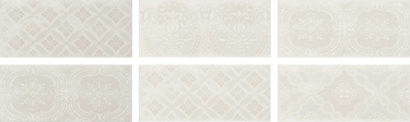 Decorative Roca Maiolica Biscuit 4x10 wall tiles with colorful geometric patterns in a mosaic style.
