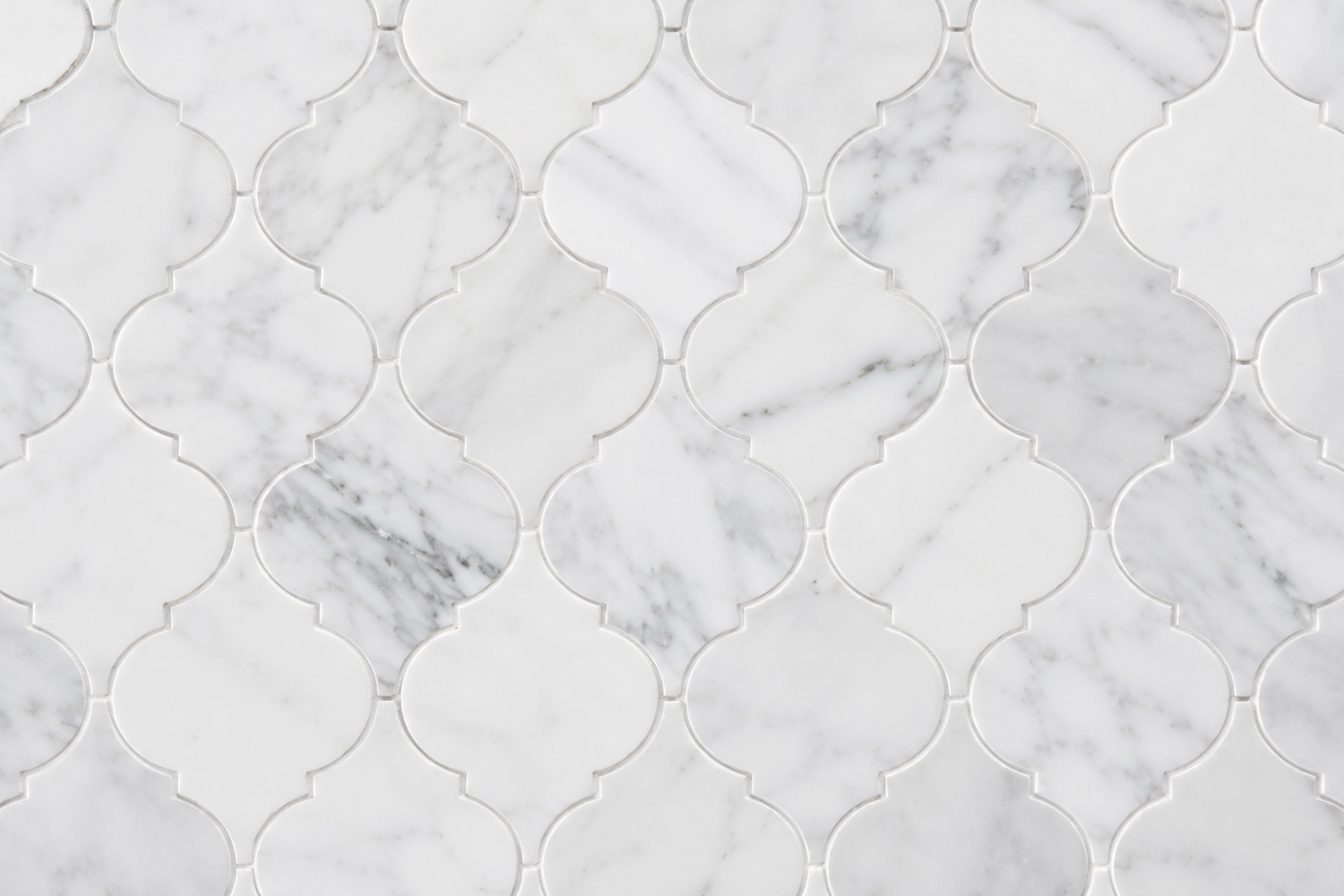 Elegant white arabesque marble tile pattern featuring premium natural stone with subtle gray veining in a seamless decorative mosaic design.