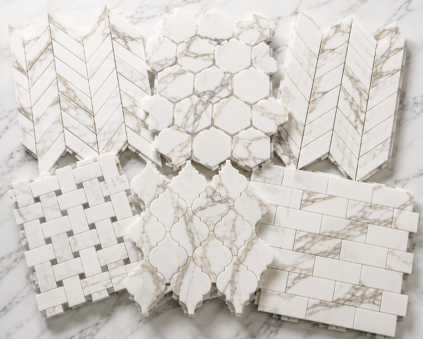 Premium Calacatta marble mosaic tile collection featuring herringbone, hexagon, chevron, basketweave, penny round, and arabesque patterns for kitchens, bathrooms, showers, and backsplashes.