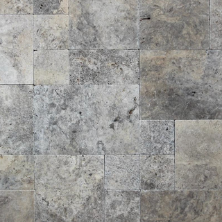 Premium Silver Travertine pool coping and pavers featuring elegant silver, gray, beige, and taupe natural stone for swimming pools, patios, walkways, and outdoor living spaces.