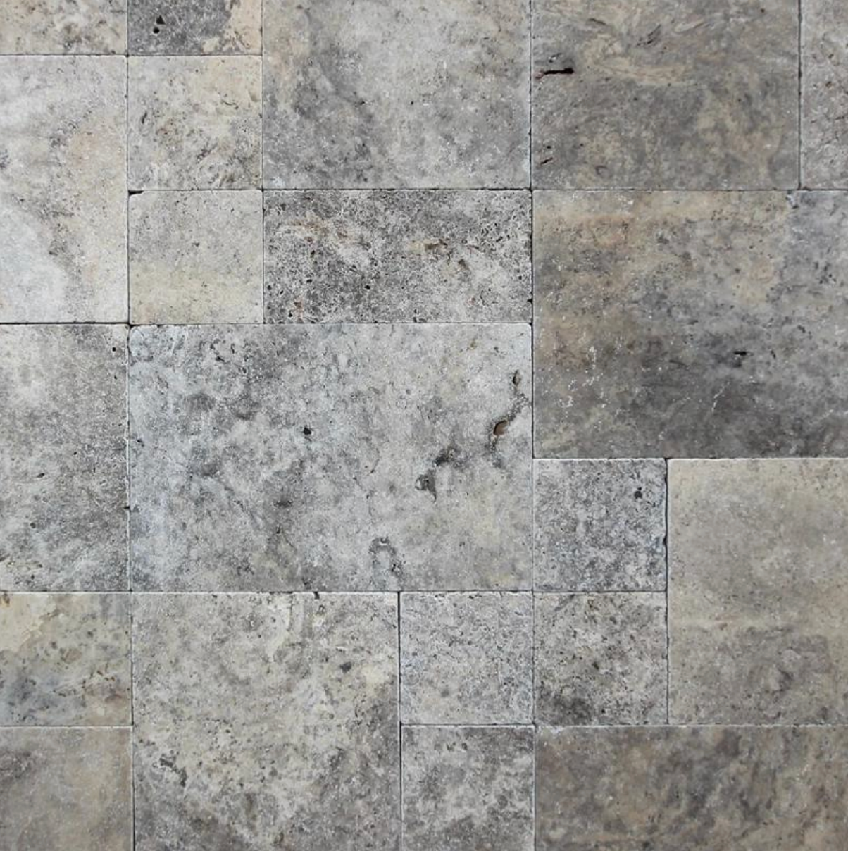 Premium Silver Travertine pool coping and pavers featuring elegant silver, gray, beige, and taupe natural stone for swimming pools, patios, walkways, and outdoor living spaces.