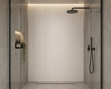 Thassos herringbone marble mosaic tile from Mythology Tile, featuring white marble pieces arranged in a classic herringbone pattern.