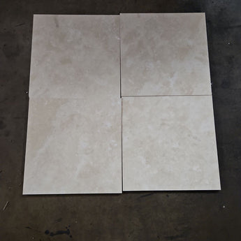 18x18 light cream filled and honed travertine field tile, natural stone surface with subtle texture and color variation.