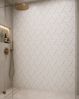 White marble waterjet mosaic wall tile with a leafy Zoey Leaves pattern by Mythology Tile, showcasing intricate leaf designs.