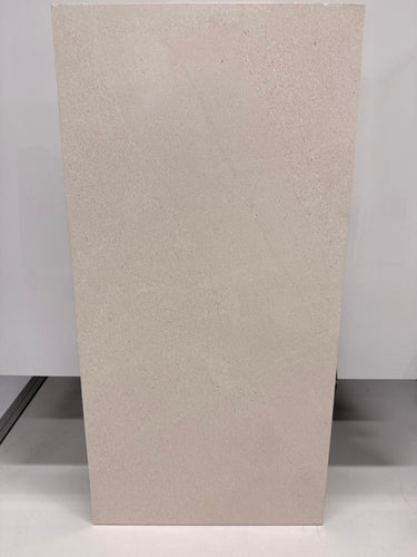 Honed Limra Limestone 12x24 natural stone tile with a smooth surface, showcasing earthy beige tones and rectangular shape.
