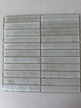 Roca Lux Dune 12x12 stacked glass mosaic tile for wall installation, featuring a sandy, textured beige design.