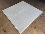 Polar White 24x48 polished natural stone tile from RN, showcasing a smooth, glossy surface with a subtle white marble pattern.